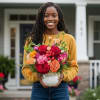 Woman holding a colorful bouquet in a white vase