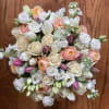 Bouquet of white and peach roses with pink tulips
