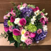 Mixed bouquet with pink calla lilies, purple hydrangeas, and white roses