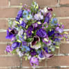 Purple bouquet with calla lilies and mixed blooms