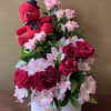 Red teddy bear with pink roses and red roses in a white box