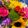 Colorful mixed bouquet with roses, sunflowers, and hydrangeas