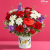 Red roses and white daisies in a Mickey Mouse vase with a heart box