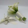 White calla lily bouquet with satin ribbon and small white flowers