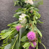 Long floral garland with white roses and pink pom-pom blooms