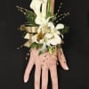 White calla lily wrist corsage with gold ribbon and bead accents