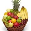 Fruit basket with pineapple, bananas, apples, grapes, oranges, and kiwi