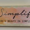 Simplify There's Beauty In Simplicity wooden plaque. 2 1/2 inch H and