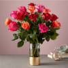 Bouquet of multicolored roses in a clear glass vase