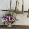 An elegant all shade purple arrangement,  that includes roses, Lisianthus, snap