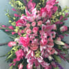Large pink floral spray with lilies and roses