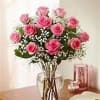 Pink rose bouquet in a clear glass vase