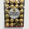Box of Ferrero Rocher chocolates in gold wrappers