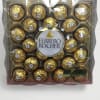 Box of Ferrero Rocher chocolates in gold wrappers