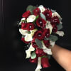 Bouquet of red roses and white calla lilies with eucalyptus accents
