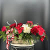 Colors and greenery combine beautifully in this gorgeous Christmas Centerpiece .It will
