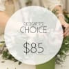 A designer-crafted arrangement featuring premium seasonal blooms ,thoughtfully styled and finished in