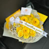 Yellow rose and gerbera bouquet with baby's breath and a white ribbon