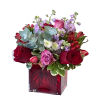 Arranged in a red glass cube, this lovely vase arrangement includes a