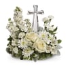 White floral arrangement with a silver cross centerpiece