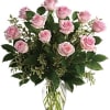 Pink roses arranged in a clear glass vase