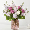 Pink and white roses in a pink glass vase