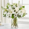 White floral bouquet in a clear glass vase