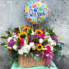 Basket of mixed flowers with a get well soon balloon