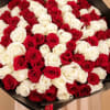 Large bouquet of red and white roses wrapped in black paper
