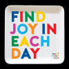 Square white sign with colorful text reading "FIND JOY IN EACH DAY"