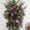 Tall standing floral spray with pink and purple blooms