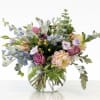 Mixed pastel bouquet in a clear glass vase