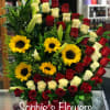 Arrangement Is build of approximately 50 total roses accompanying by by sunflowers
