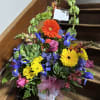 Send a bright colored flower arrangement to let them know you are