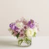 Lavender and white bouquet in a clear glass vase