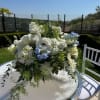 The Blue &amp; White Serenity Pedestal is a lush, full floral arrangement