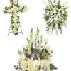White funeral floral set with a cross, standing spray, and urn arrangement