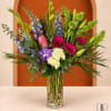 Colorful mixed bouquet in a clear glass vase