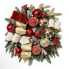 Christmas wreath with red and gold ornaments and ribbon on evergreen branches