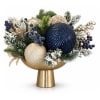 Gold vase with a blue and gold holiday arrangement