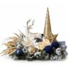 Holiday centerpiece with a white deer, gold cone tree, and ornaments