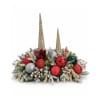 Christmas centerpiece with red ornaments and frosted greenery