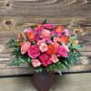 Pink and orange mixed bouquet in a brown vase