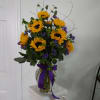 One dozen sunflowers arranged to bring some sunshine to someone special.