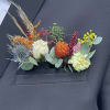 Colorful boutonniere on a dark suit jacket