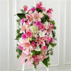 Pink and white floral standing spray with lilies and roses