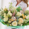 A serene bouquet of gorgeous fresh flowers, expertly arranged by a skilled