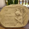 Memorial stone with an angel and engraved sympathy message
