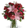 Red and pink mixed bouquet in a clear glass vase