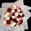 Bouquet of red, pink, and white roses wrapped in pale paper